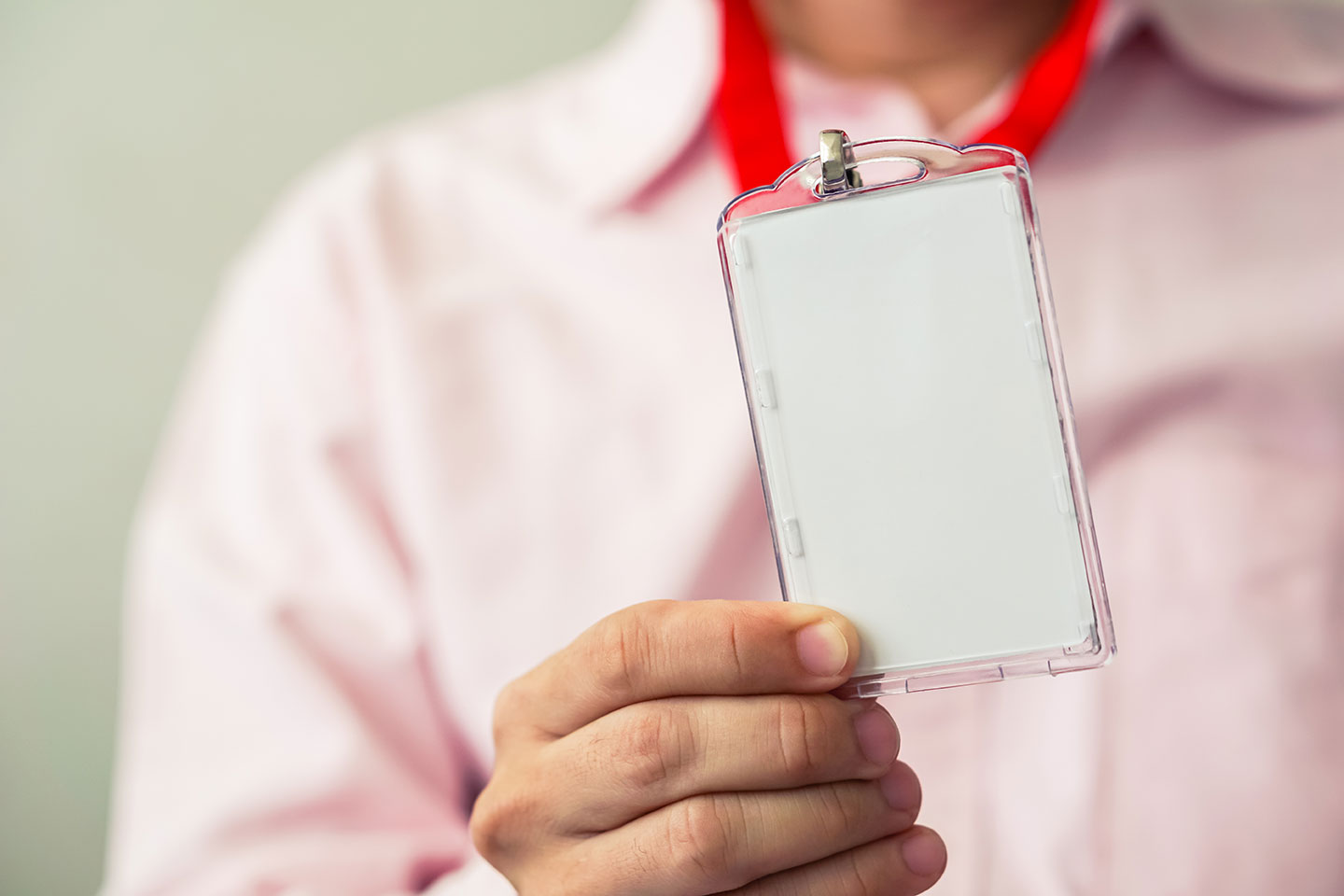 Man showing ID badge